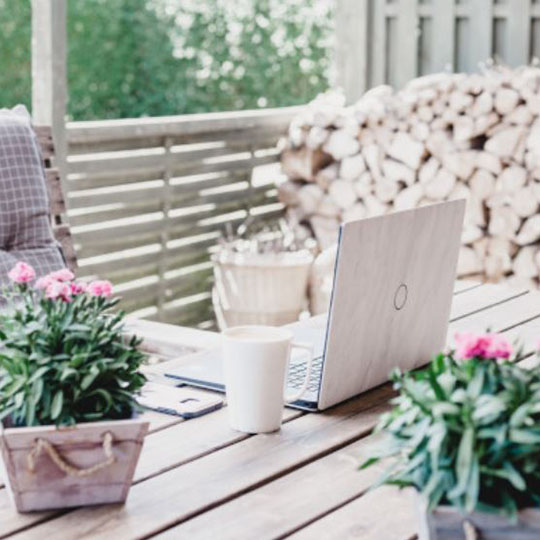  Laptop on a table with flowers 