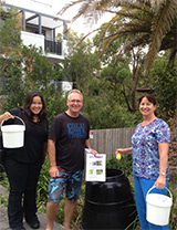 compost collective three people holding white compost buckets