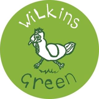 Illustration of a chicken on grass alongside the place name 'Wilkins Green'