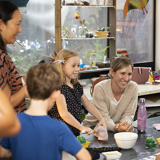 Children and carers at a table 