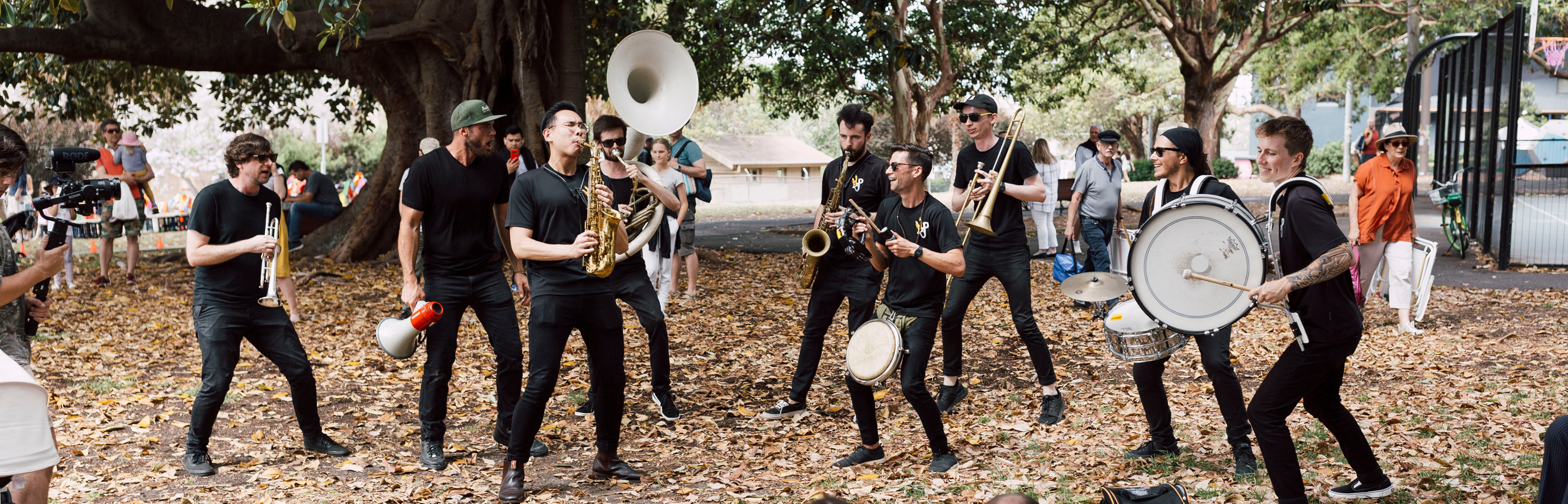 Musicians with brass instruments in a park
