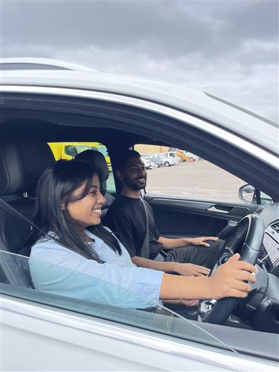 Female learner driver with male supervisor