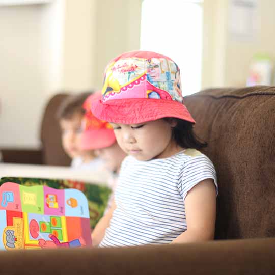 Girl reading on seat