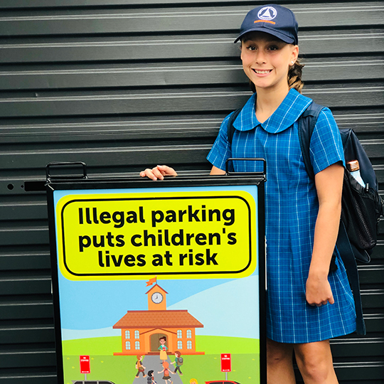 School girl with road and safety