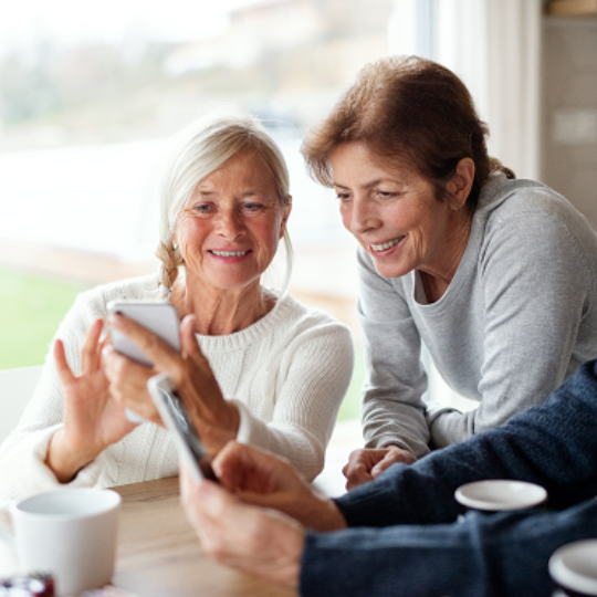 Two older women chatting 
