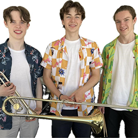 three young men holding their instruments against a white background