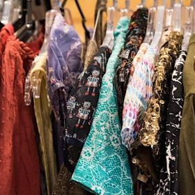 Colourful second hand clothing on a rack