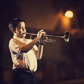 Child playing the trumpet