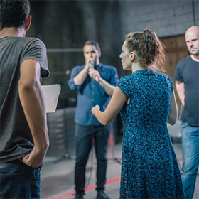 Director rehearses the play with actors