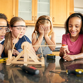 Girls playing with a catapult