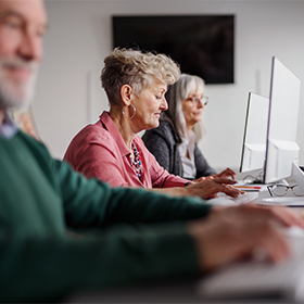 Group of senior people attending computer and technology education