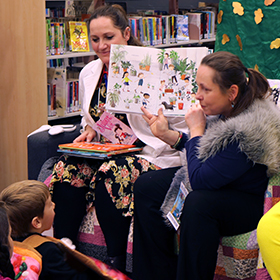 Library staff reading to children