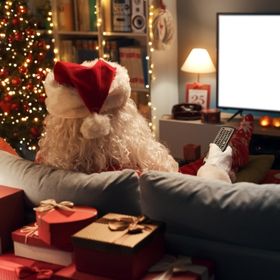 Santa Claus watching television at home