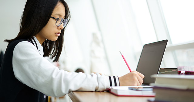 Student studying in a library