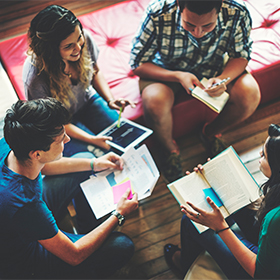 Students in conversation in a library