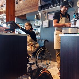 Two baristas at work