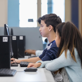 Two students in a computer lab 