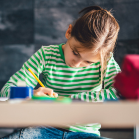 Young girl writing poetry