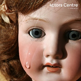 Photo of an old fashioned dolls face crying