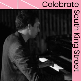 Photo of Jazz musician Aaron Blakey sitting profile at a piano, black and white  photo with pink frame that reads Celebrate South King