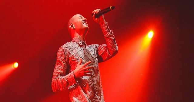 Singer on stage performing with lighting