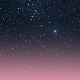 Photo of the night sky, ligh purple with ombre colour change up to a dark black night sky, little silver white stars sprinkle throughout the photo