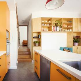 Interior of modern home showing stairs and kitchen