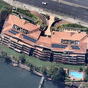 Aerial view of apartment rooftops with solar panels