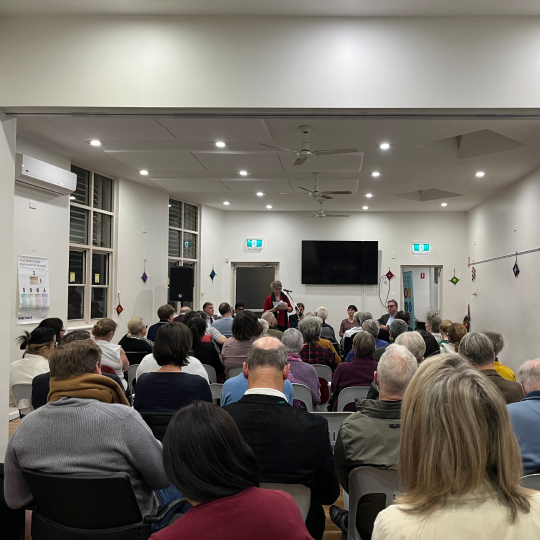 audience seated in a large hall