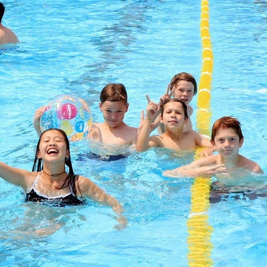 children playing in the pool
