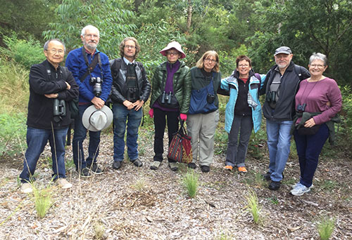 GreenWay birdos group of people standing amongst the bush ready to do birdwatching
