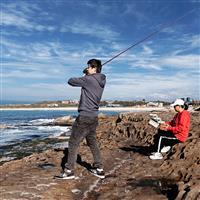 Man rock fishing with no life jacket