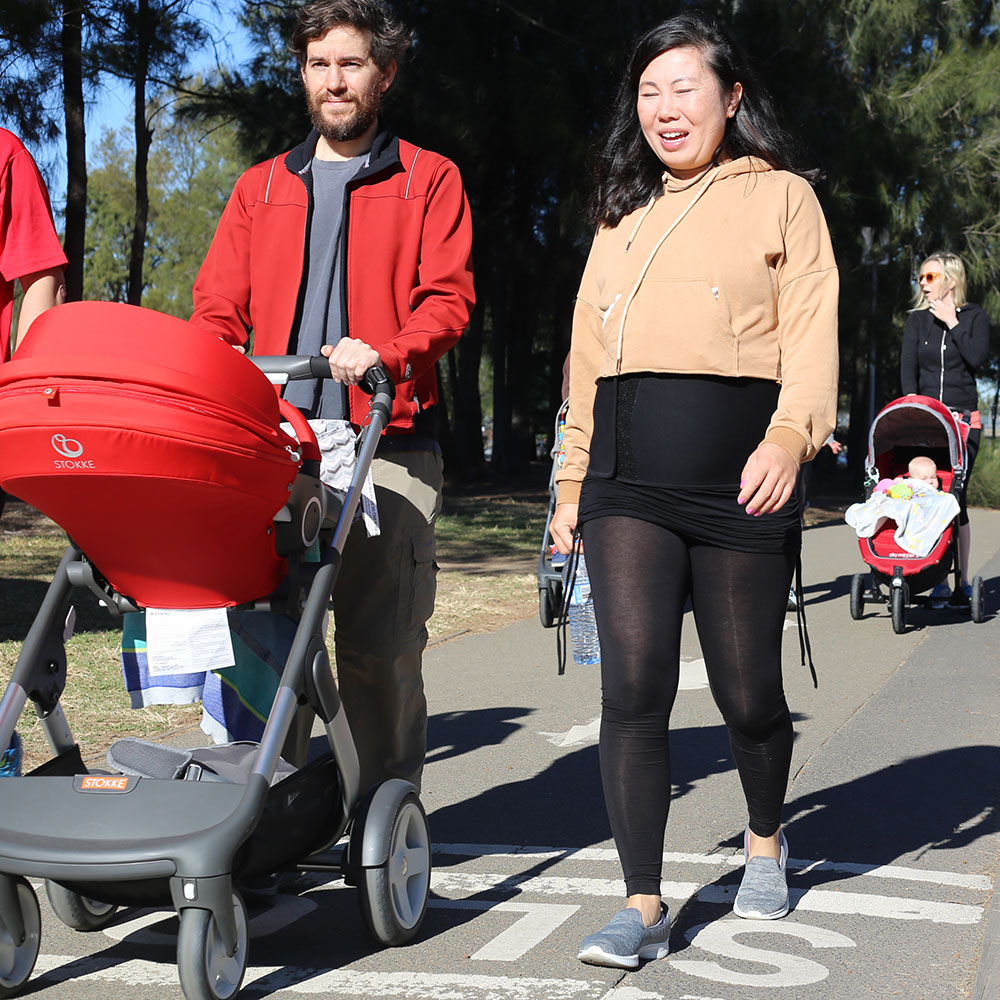 Parents pushing a pram 