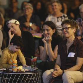 People and a child in an audience