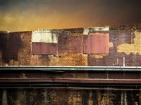 Textured brick wall with sky back drop orange palette