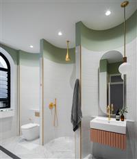 Bathroom interior of white tiles and green top framing with three concave sections each housing a toilet shower and basin featuring brass fixtures a grey towel a mirror and a hanging white pendant light