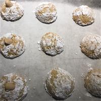 Amaretti morbidi italian biscuits with alomnd on top coated in white icing sugar powder