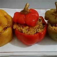 3 capsicums, yellow and red stuffed with vegetables and rice