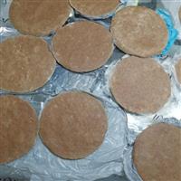 Brown flatbreads sit on table spread out