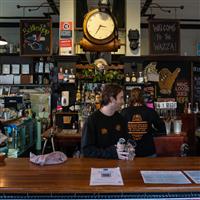 A bar and two bar staff in a characteristic Inner West Sydney pub