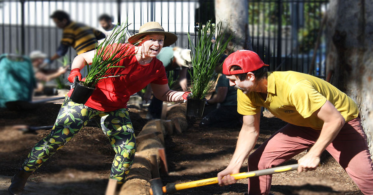 Woman smiling  and focused man working in a garden