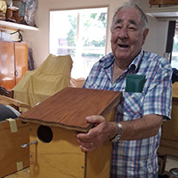Jack Wilson with possum boxes at Haberfield Mens Shed