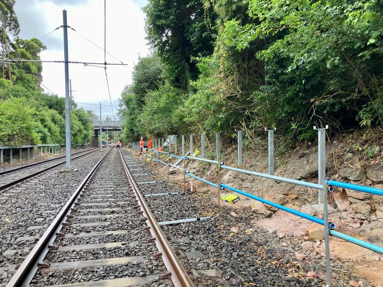 High Voltage feeder under construction - posts being installed by the light rail