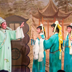 A man and three women in traditional Chinese Opera Costumes