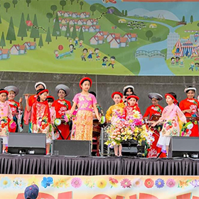 A group of children in traditional Vietnamese costumes