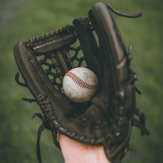 Baseball inside a baseball mitt