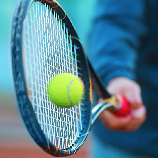  Tennis racquet hitting a ball