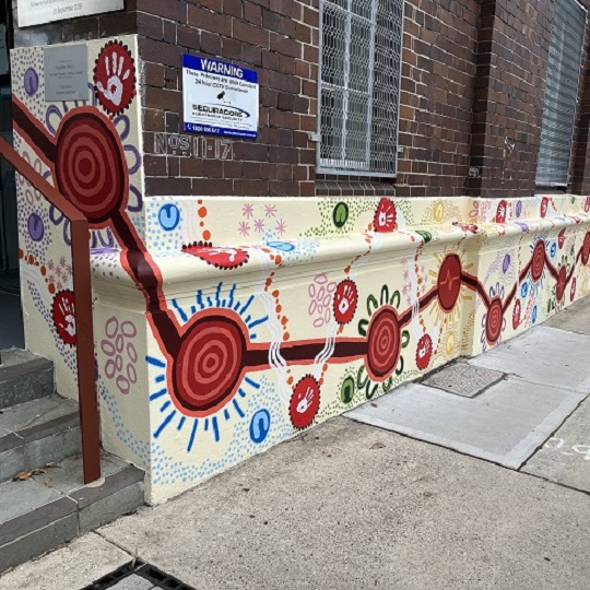 Banyar Dulguh - Indigenous mural including colours of blue, reg, orange and green 