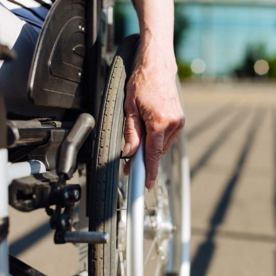 Close up view of a person on a wheelchair