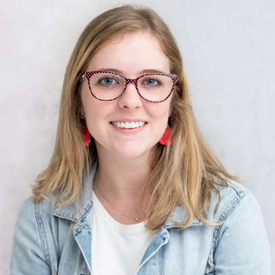 Headshot of a smiling woman in glasses